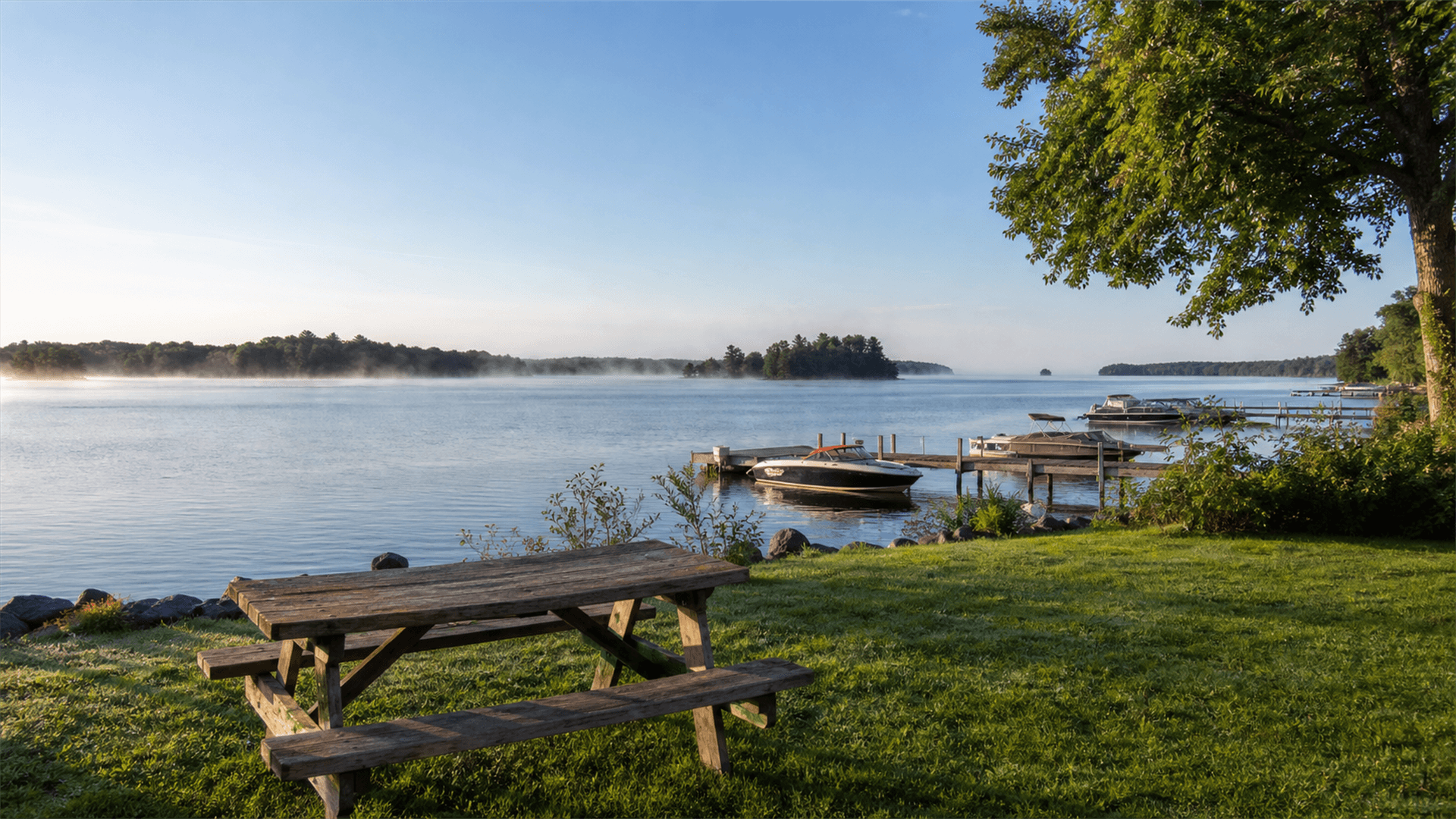 Morning view across the St. Lawrence River with boats and wooded islands